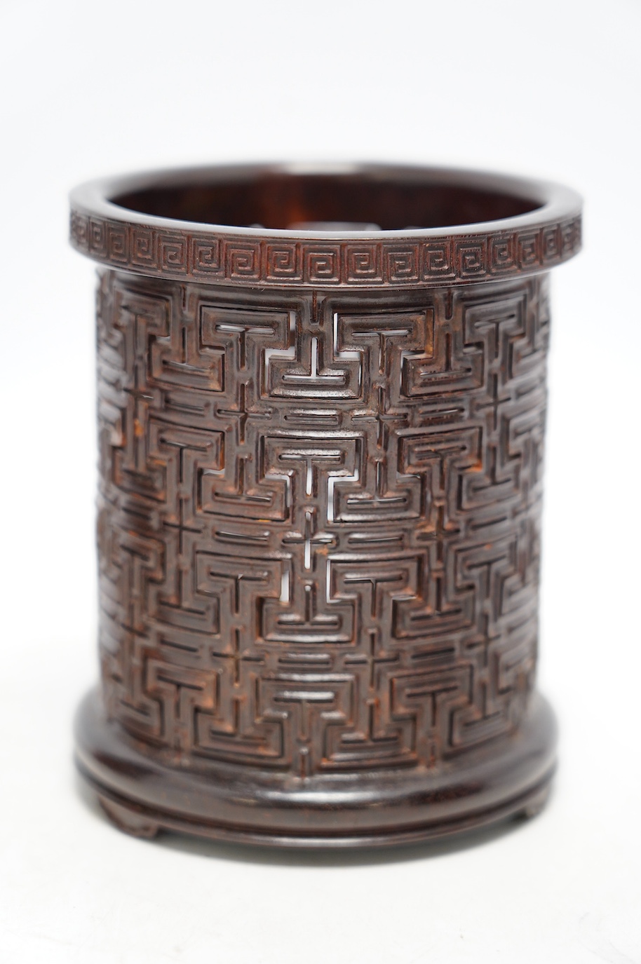 Two finely carved Chinese bamboo brush pots, and a reticulated hardwood brushpot, largest 14.5cm high. Condition - bamboo pots with cracks